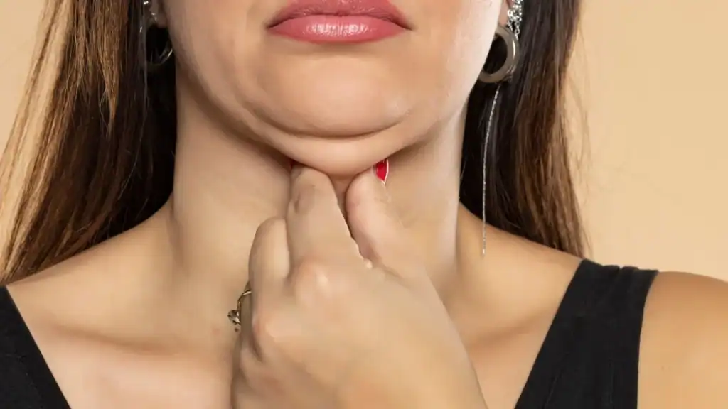 An image of a woman with double chin, sad, worried : Non Surgical Double Chin Removal Treatment in Thetford, UK
